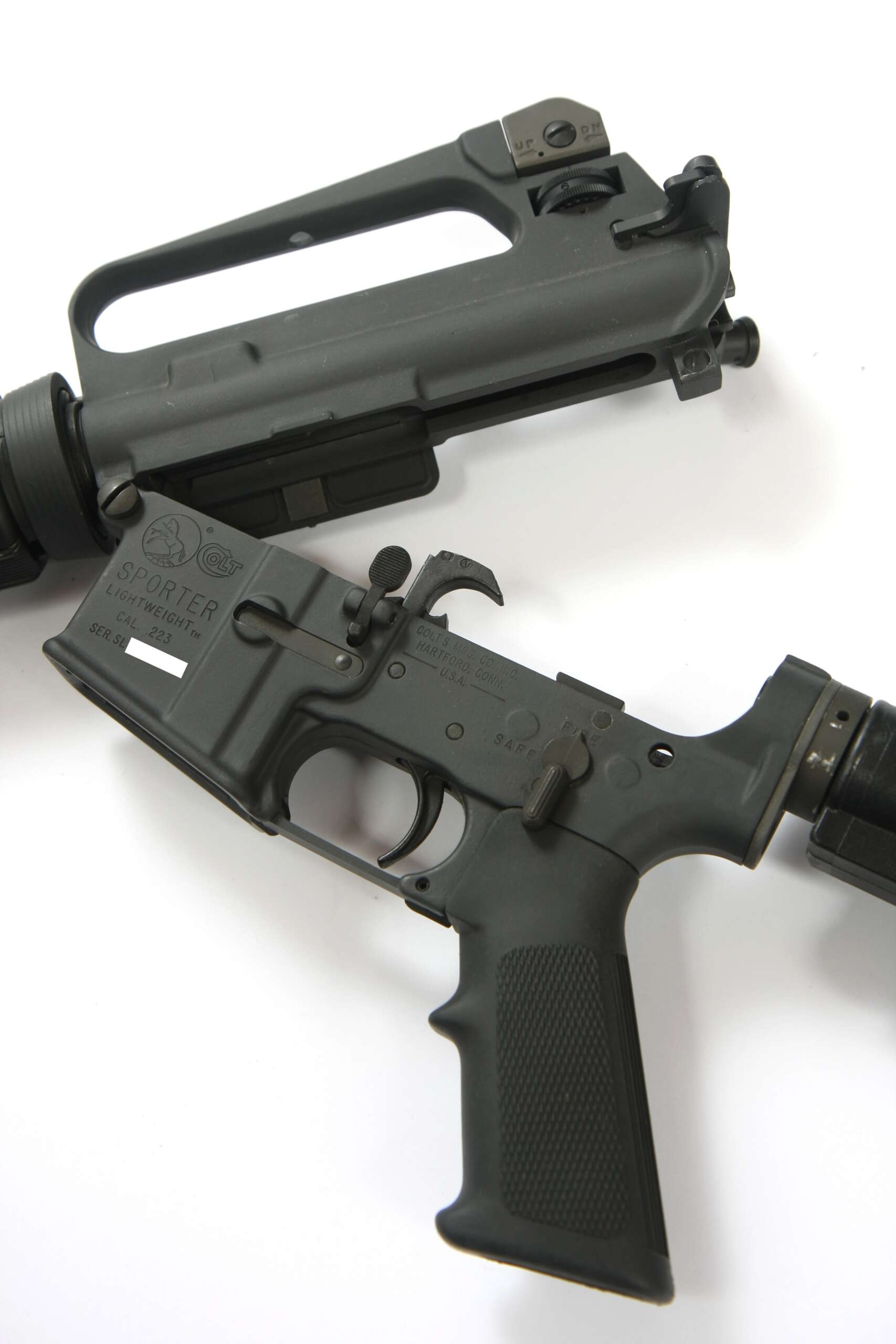 A pre-ban Colt AR-15 Sporter Lightweight rifle with upper and lower receivers separated