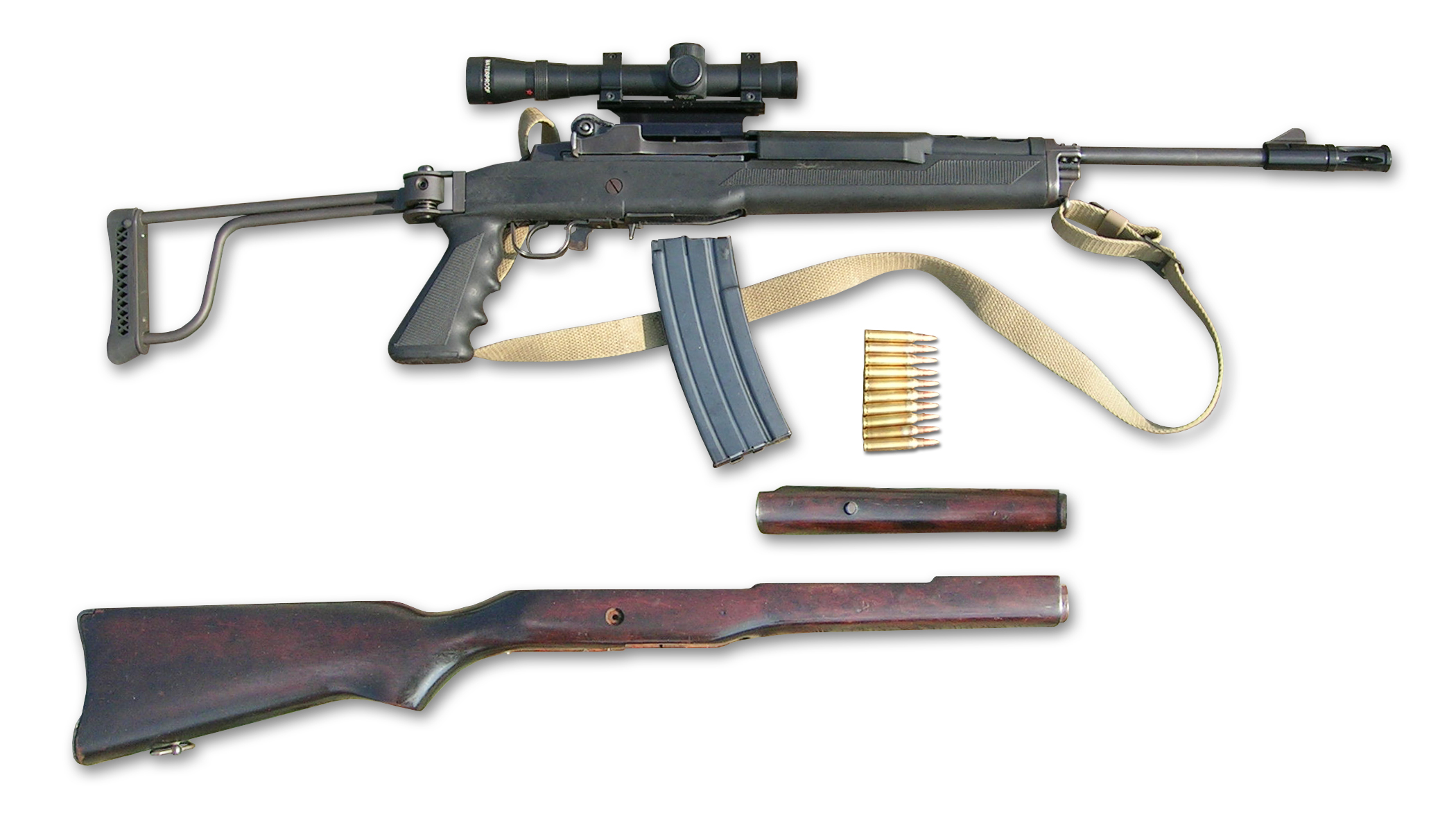 A scoped Ruger Mini-14 rifle with a folding stock, shown with a scope, magazine, ammunition and its original wood stock removed alongside it, from former Irish police stocks