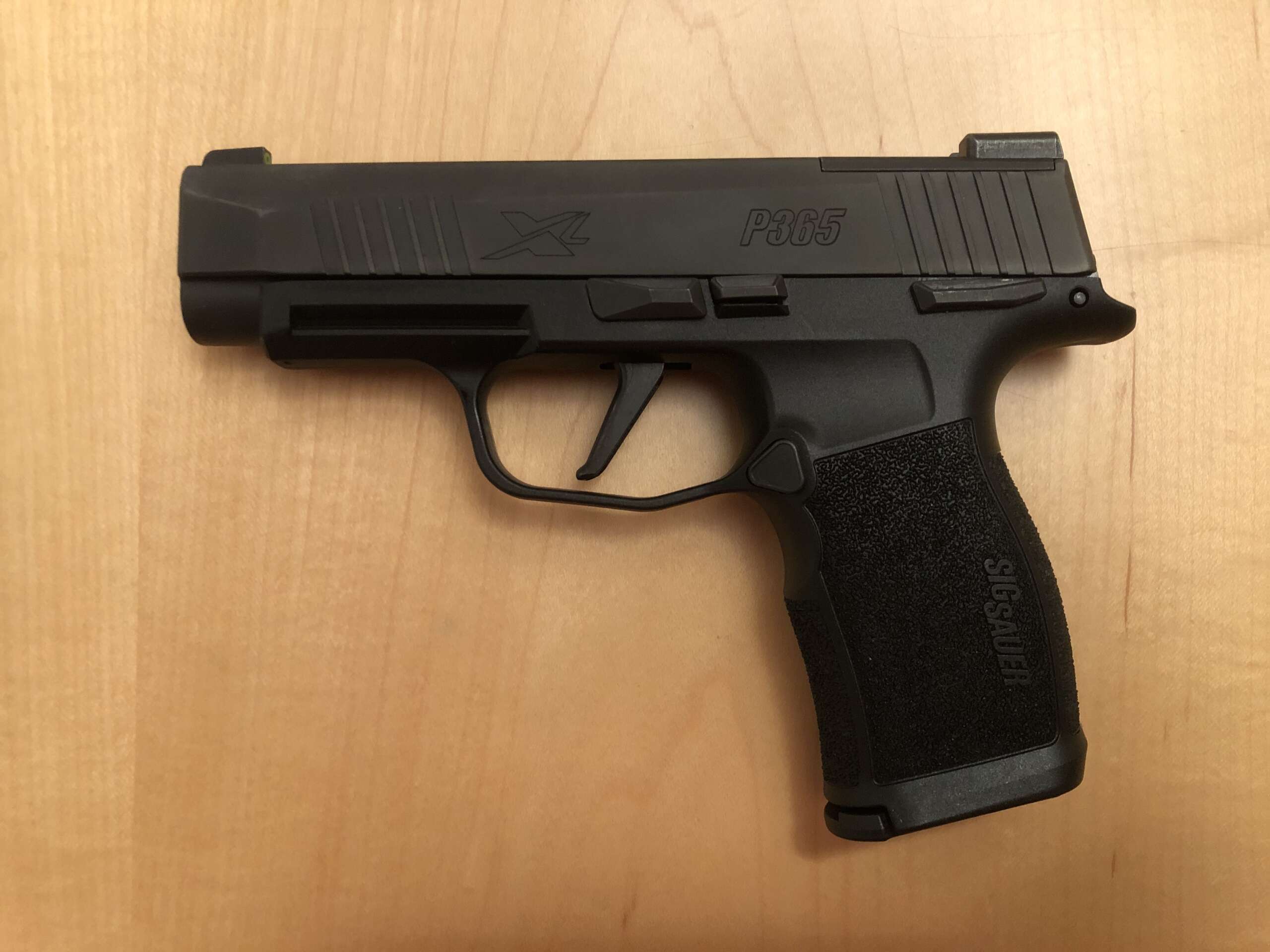 A SIG Sauer P365 XL pistol, a longer-grip variant of the original P365