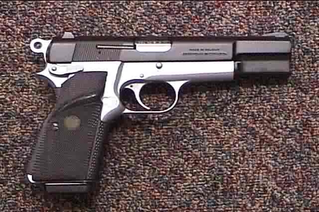 A two-tone Browning Hi-Power pistol with adjustable target sights